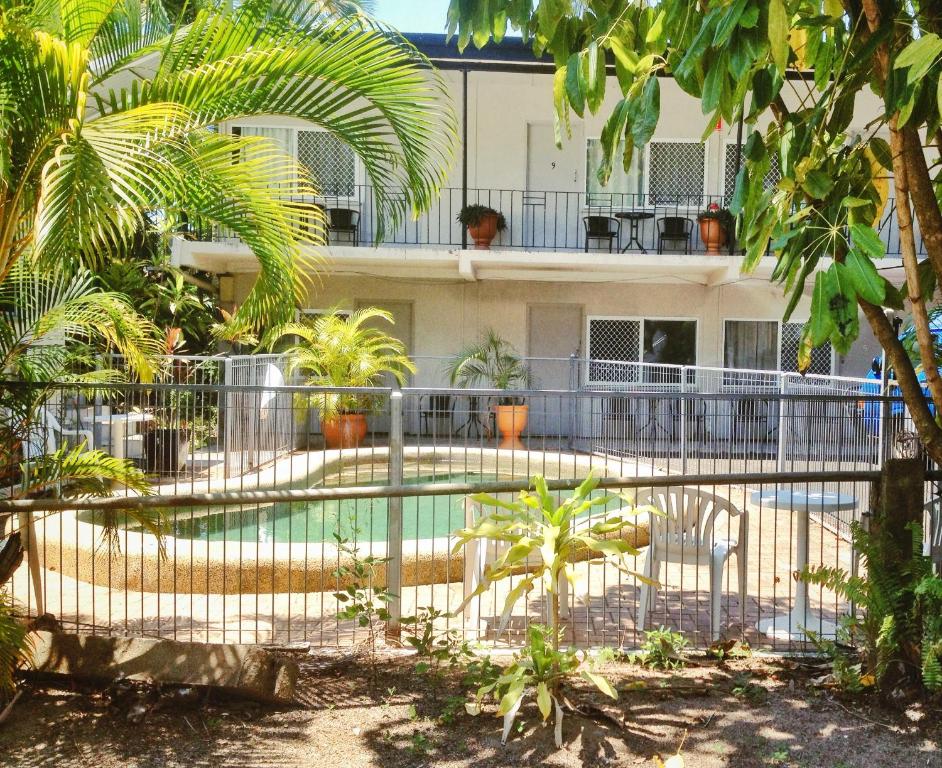 Cairns City Motel's outdoor swimming pool surrounded by tropical greenery