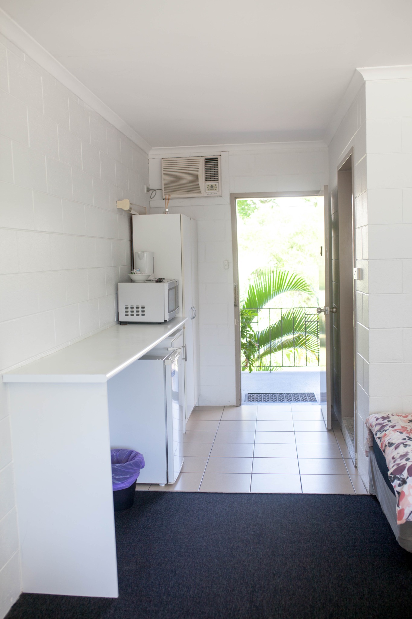 Room entry and kitchenette at Cairns City Motel